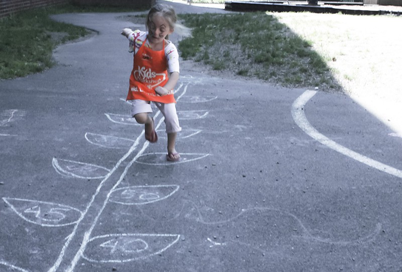 Child on a hopscotch drawing