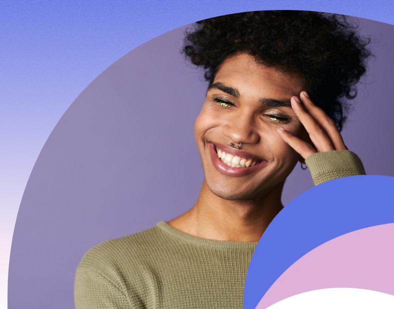 Image of a person smiling widely with eyes closed and their left hand on their temple. Decorative blue, pink circle.