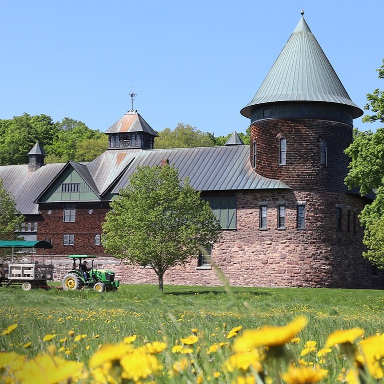 Photo of a 19th century building, with conic towers, on Shelburne Farms Vermont